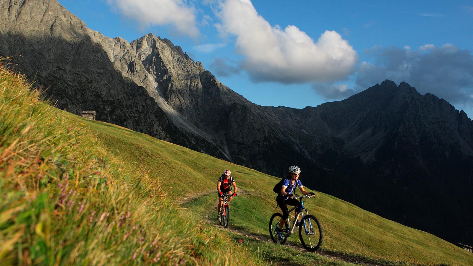 two people on their mountain bikes during a trip near Hotel Alpenfrieden