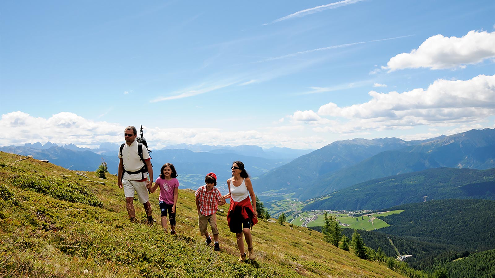 a family on a hike near Hotel Alpenfrieden